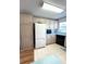 White appliances and light wood cabinets in this kitchen at 563 Portside Dr, North Port, FL 34287