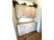 White cabinets and countertops with sunflower decor at 563 Portside Dr, North Port, FL 34287