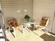 Small patio with table and chairs, ideal for relaxing at 563 Portside Dr, North Port, FL 34287