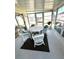 Sunroom with white wicker furniture and a view of the outdoors at 563 Portside Dr, North Port, FL 34287
