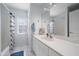 Clean bathroom with white vanity, bathtub, and shower at 5891 Madison Rd, Venice, FL 34293