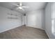 Spacious bedroom with wood-look floors and ceiling fan at 5891 Madison Rd, Venice, FL 34293