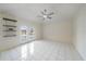 Bedroom with tile floors, ceiling fan, and pool view at 5891 Madison Rd, Venice, FL 34293