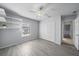 Bedroom with gray walls, wood-look tile, and a large closet at 5891 Madison Rd, Venice, FL 34293