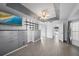 Spacious bedroom with built-in shelving and a view to another room at 5891 Madison Rd, Venice, FL 34293