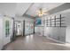 Bedroom with tiled floors, French doors to patio, and modern built-ins at 5891 Madison Rd, Venice, FL 34293
