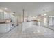 Bright kitchen with white cabinets, granite countertops, and stainless steel appliances at 5891 Madison Rd, Venice, FL 34293