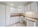 Bright kitchen with white cabinets and granite countertops at 5891 Madison Rd, Venice, FL 34293
