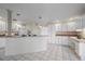 Bright kitchen with white cabinets, granite countertops, and stainless steel appliances at 5891 Madison Rd, Venice, FL 34293