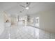 Bright kitchen with white cabinets, granite countertops, and stainless steel appliances at 5891 Madison Rd, Venice, FL 34293