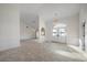 Bright and airy living room with tile flooring and high ceilings at 5891 Madison Rd, Venice, FL 34293