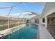 Refreshing screened pool perfect for relaxation at 5891 Madison Rd, Venice, FL 34293
