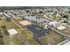 Aerial view of community amenities including tennis courts and clubhouse at 6232 Drucker Cir, Port Charlotte, FL 33981