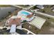 Aerial view of community pool, shuffleboard, and clubhouse at 6232 Drucker Cir, Port Charlotte, FL 33981