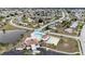 Aerial view showing community pool, shuffleboard, and clubhouse at 6232 Drucker Cir, Port Charlotte, FL 33981