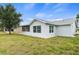 Updated home featuring a screened-in patio and spacious yard at 6232 Drucker Cir, Port Charlotte, FL 33981