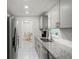 Modern kitchen with gray cabinets and granite countertops at 6232 Drucker Cir, Port Charlotte, FL 33981
