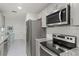 Modern kitchen with stainless steel appliances and granite countertops at 6232 Drucker Cir, Port Charlotte, FL 33981