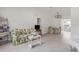Spacious living area with tiled floor, sofa, and access to other rooms at 6232 Drucker Cir, Port Charlotte, FL 33981