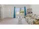 Bright living room features tiled floors, comfy sofa, and window view at 6232 Drucker Cir, Port Charlotte, FL 33981