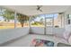 Spacious screened porch, ceiling fan, and view of the backyard at 6232 Drucker Cir, Port Charlotte, FL 33981