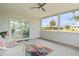 Relaxing screened porch with ceiling fan and view of backyard at 6232 Drucker Cir, Port Charlotte, FL 33981