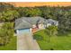 Single-story house with a large yard, driveway, and two-car garage at 740 Citrus Rd, Venice, FL 34293