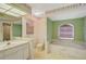 Bathroom with bathtub, toilet, and vanity at 740 Citrus Rd, Venice, FL 34293