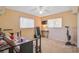 Cozy bedroom with daybed, small TV, and home exercise equipment at 740 Citrus Rd, Venice, FL 34293