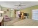 Large bedroom with a sitting area and private access to the bathroom at 740 Citrus Rd, Venice, FL 34293