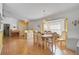 Spacious dining room with hardwood floors, a large table, and a built-in hutch at 740 Citrus Rd, Venice, FL 34293