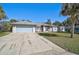 House with light blue garage door and driveway at 740 Citrus Rd, Venice, FL 34293