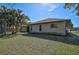 Back exterior of house showing landscaping and shed at 740 Citrus Rd, Venice, FL 34293