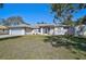House exterior with attached garage and manicured lawn at 740 Citrus Rd, Venice, FL 34293