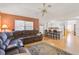 Spacious living room with open floor plan, featuring a large sectional sofa and kitchen views at 740 Citrus Rd, Venice, FL 34293