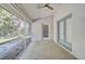 Spacious screened porch with concrete floor, ceiling fan and French doors at 740 Citrus Rd, Venice, FL 34293