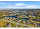 Community overview featuring various house styles and water features at 7484 Ripetta St, Sarasota, FL 34240