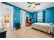 Spacious bedroom with a queen bed, wood floors, and access to a hallway at 7484 Ripetta St, Sarasota, FL 34240
