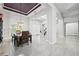 Bright dining room features a dark wood table with leather chairs, and high ceilings at 7484 Ripetta St, Sarasota, FL 34240