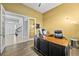 Spacious home office features built-in desk and view into the home's foyer at 7484 Ripetta St, Sarasota, FL 34240