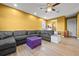Playroom boasts a sectional sofa, ceiling fan, and plenty of space for to play at 7484 Ripetta St, Sarasota, FL 34240