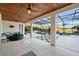 Relaxing pool area with covered patio and lush landscaping at 7484 Ripetta St, Sarasota, FL 34240