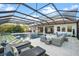 Stunning pool and patio area with covered lanai and fire pit at 7484 Ripetta St, Sarasota, FL 34240