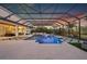 Large, rectangular pool with a covered patio and lounge area at 7484 Ripetta St, Sarasota, FL 34240