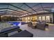 Large, rectangular pool with a covered patio and lounge area at 7484 Ripetta St, Sarasota, FL 34240