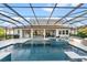 Large, rectangular pool with a covered patio and lounge area at 7484 Ripetta St, Sarasota, FL 34240