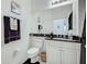 Clean bathroom with toilet, vanity, and granite countertop at 804 Triano Cir # 804, Venice, FL 34292