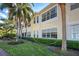 Building exterior showcasing a window and lush landscaping at 804 Triano Cir # 804, Venice, FL 34292