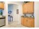 Kitchen with light wood cabinets, granite counters, and stainless steel appliances at 804 Triano Cir # 804, Venice, FL 34292
