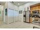 Kitchen with light wood cabinets and stainless steel appliances at 804 Triano Cir # 804, Venice, FL 34292